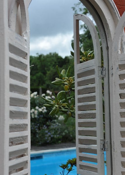 Garden wall mirror with shutters