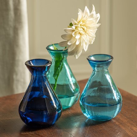 Three blue glass bud vases