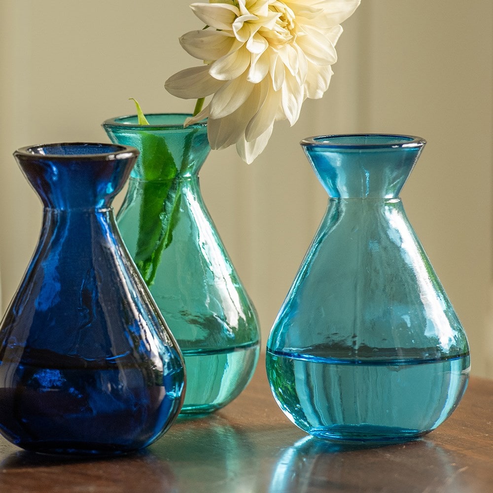 Three blue glass bud vases