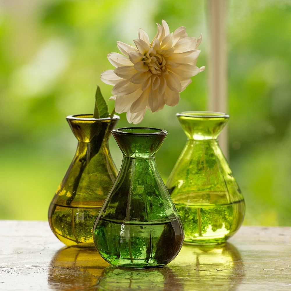 Three green glass bud vases