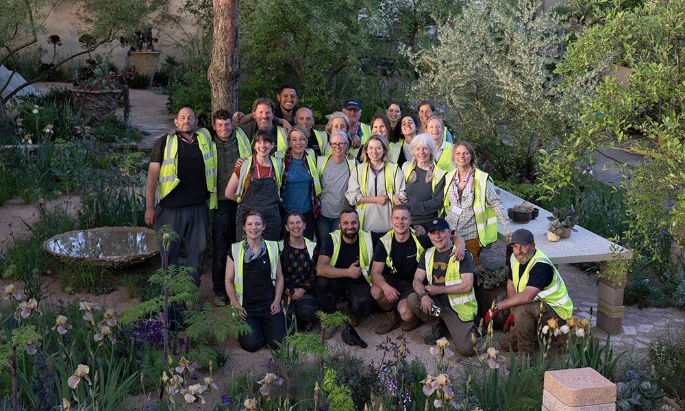 The build and planting team finish the garden tired but happy!
