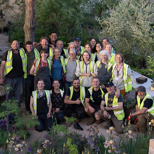 The build and planting team finish the garden tired but happy!