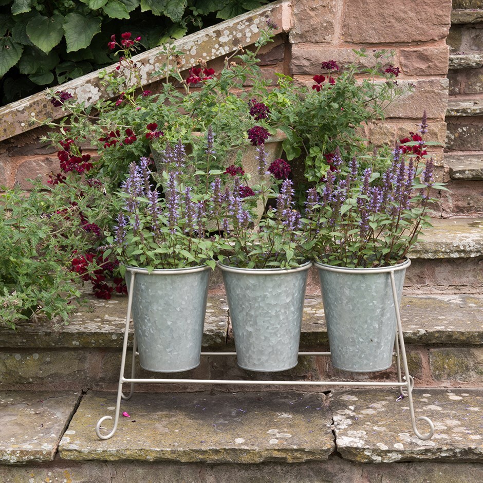 Three galvanised pots and stand