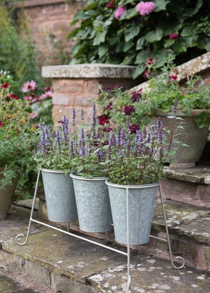 Three galvanised pots and stand