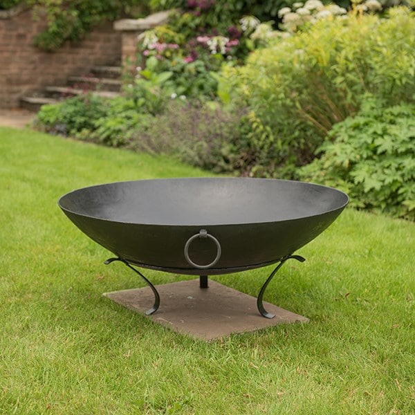 Iron disc fire pit bowl with tripod base