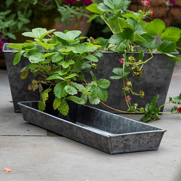 Dark galvanised metal window trough tray