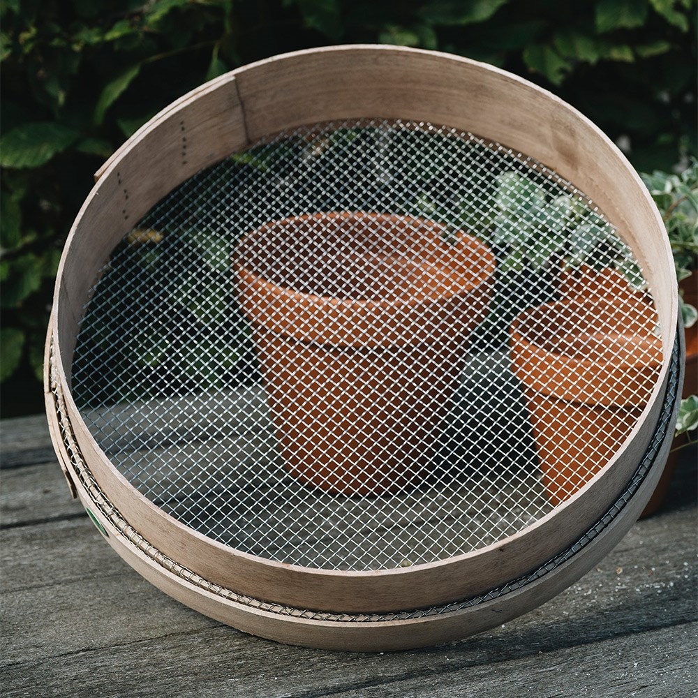 Traditional wooden garden riddle