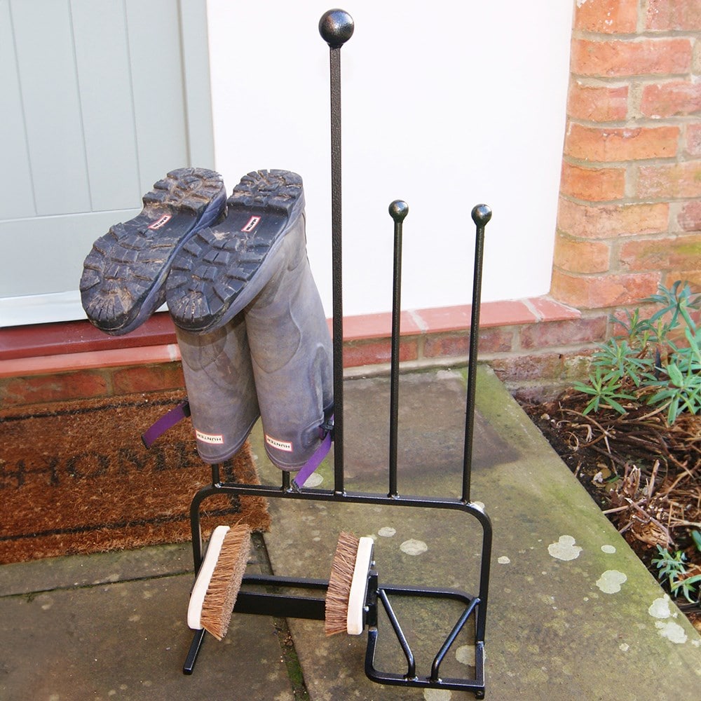 Boot store with cleaning brush and boot jack