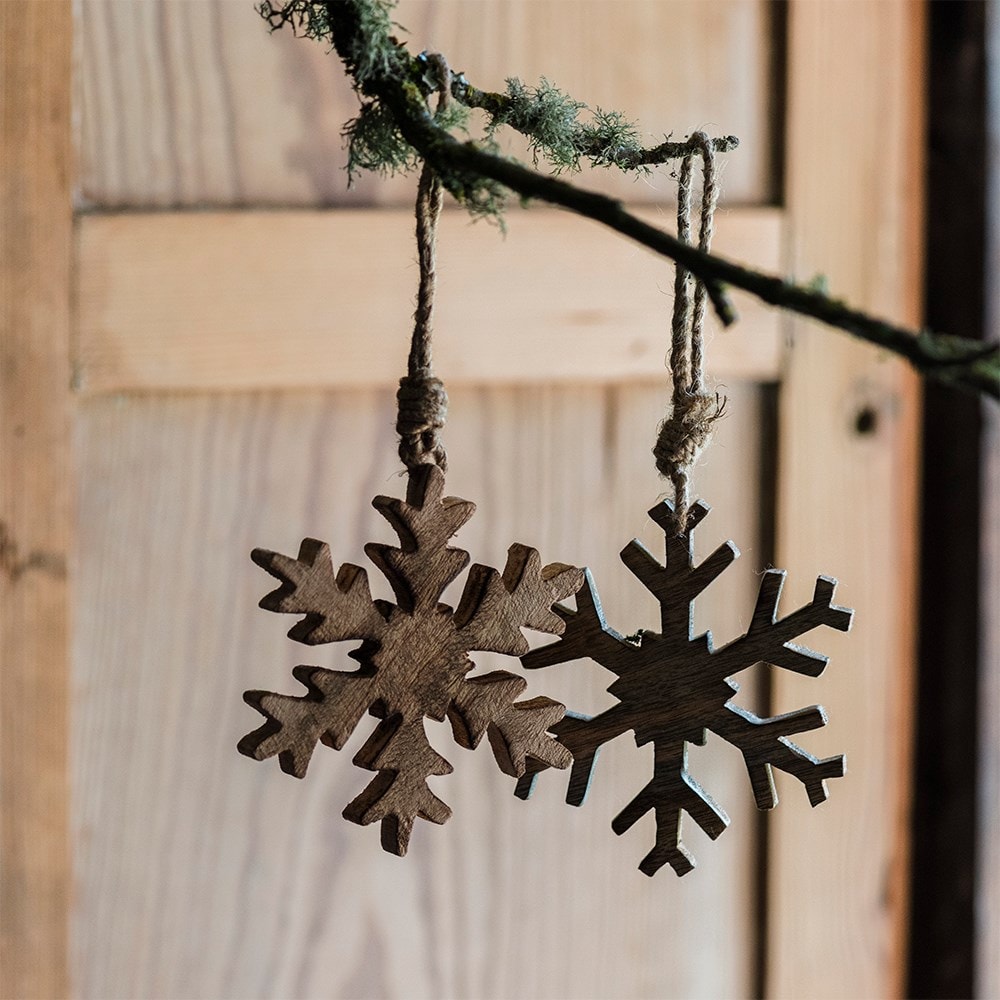 Two wooden snowflake decorations