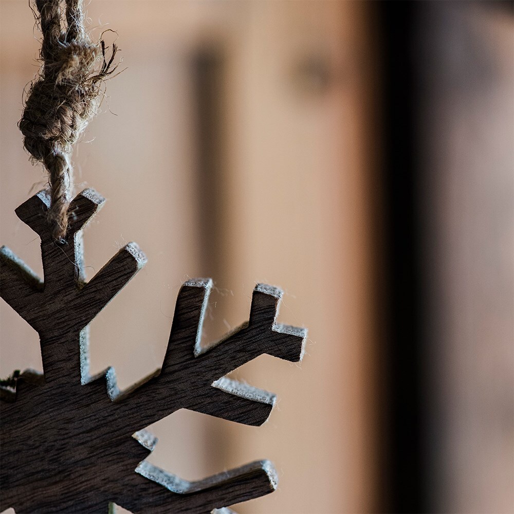 Two wooden snowflake decorations