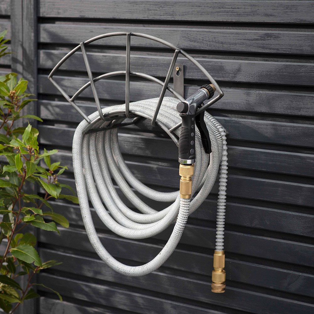 Wall mounted hose tidy
