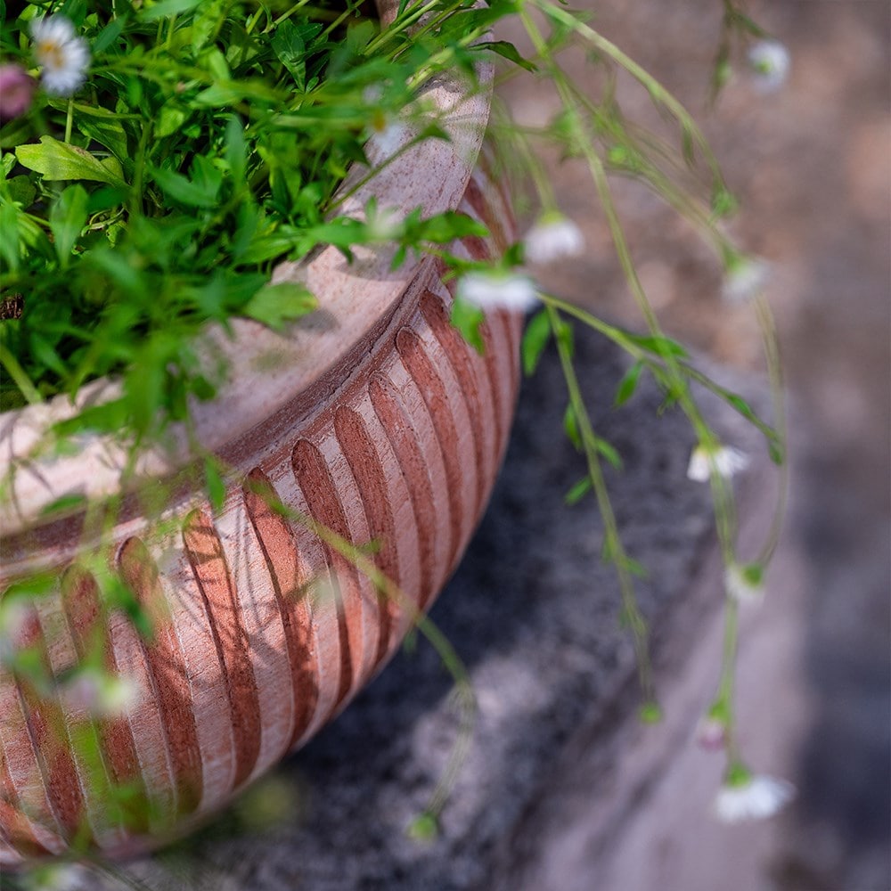 Curved ribbed terracotta pot