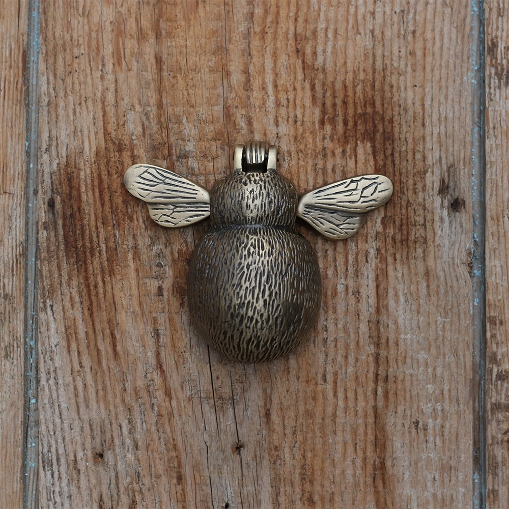 Aged brass bee door knocker