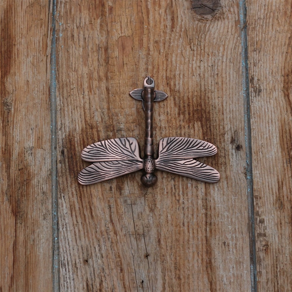 Aged bronze dragonfly door knocker
