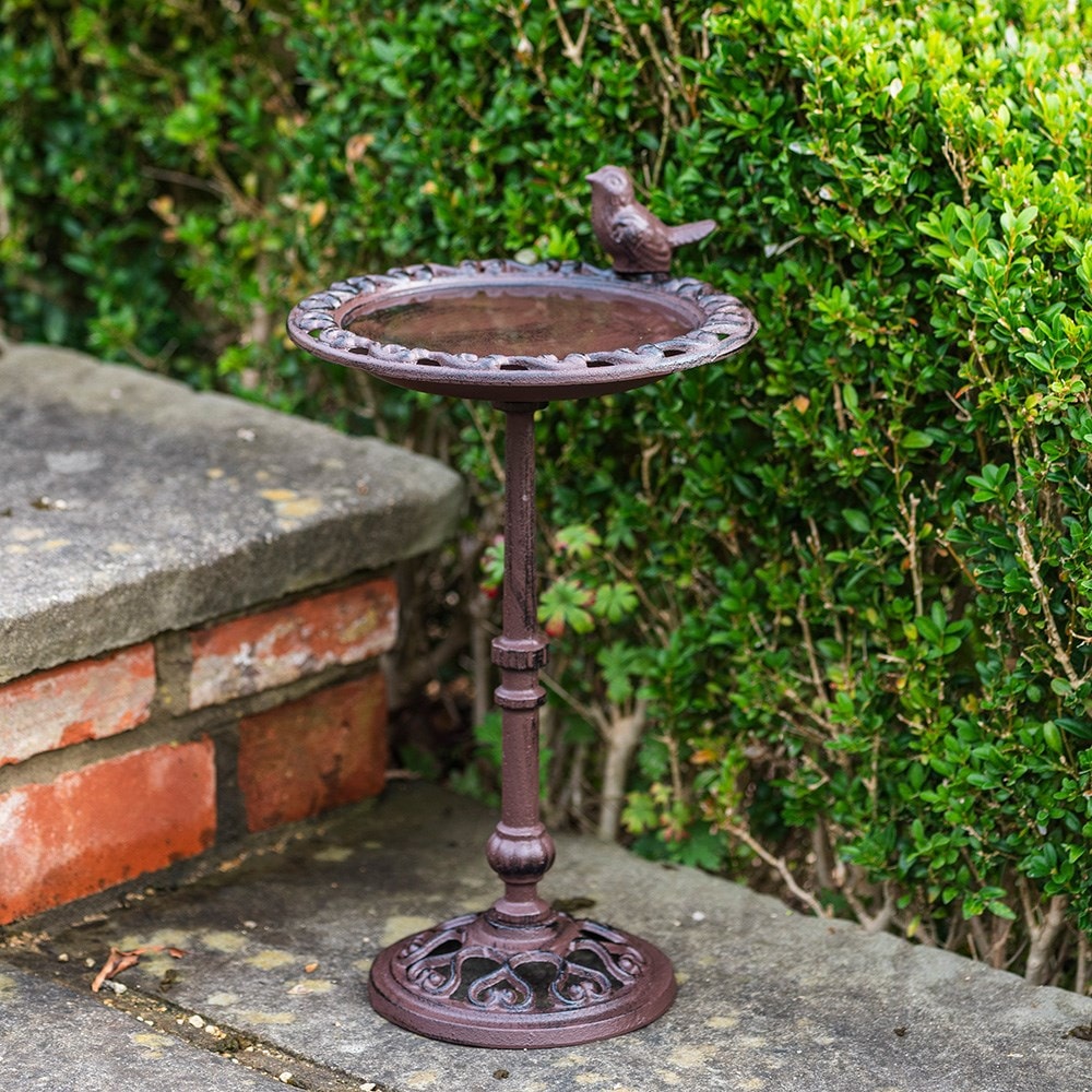 Cast iron bird bath on pedestal - rust