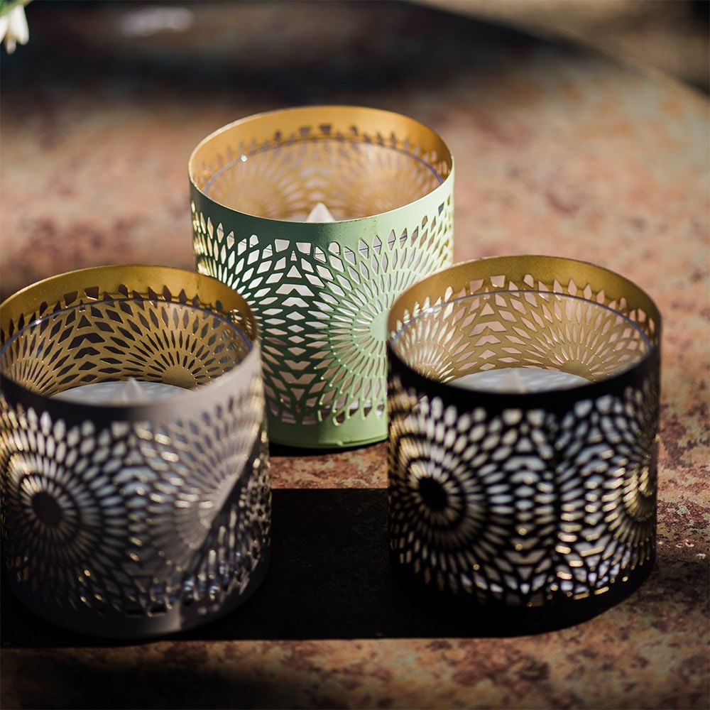 Three solar cut out tea lights