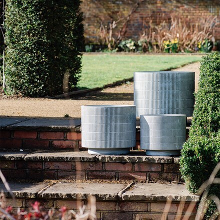 Set of three cylinder footed planters - etched khaki