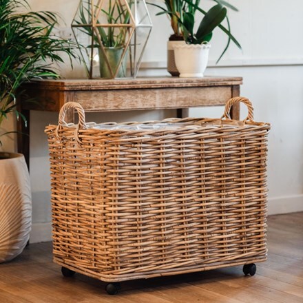 Wicker log basket on wheels