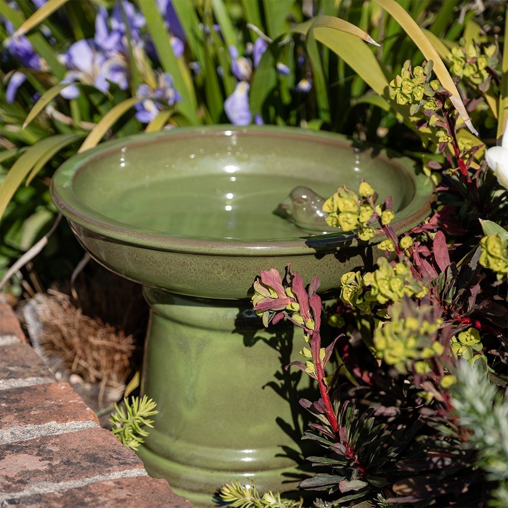 Small ceramic bird bath on pedestal - green