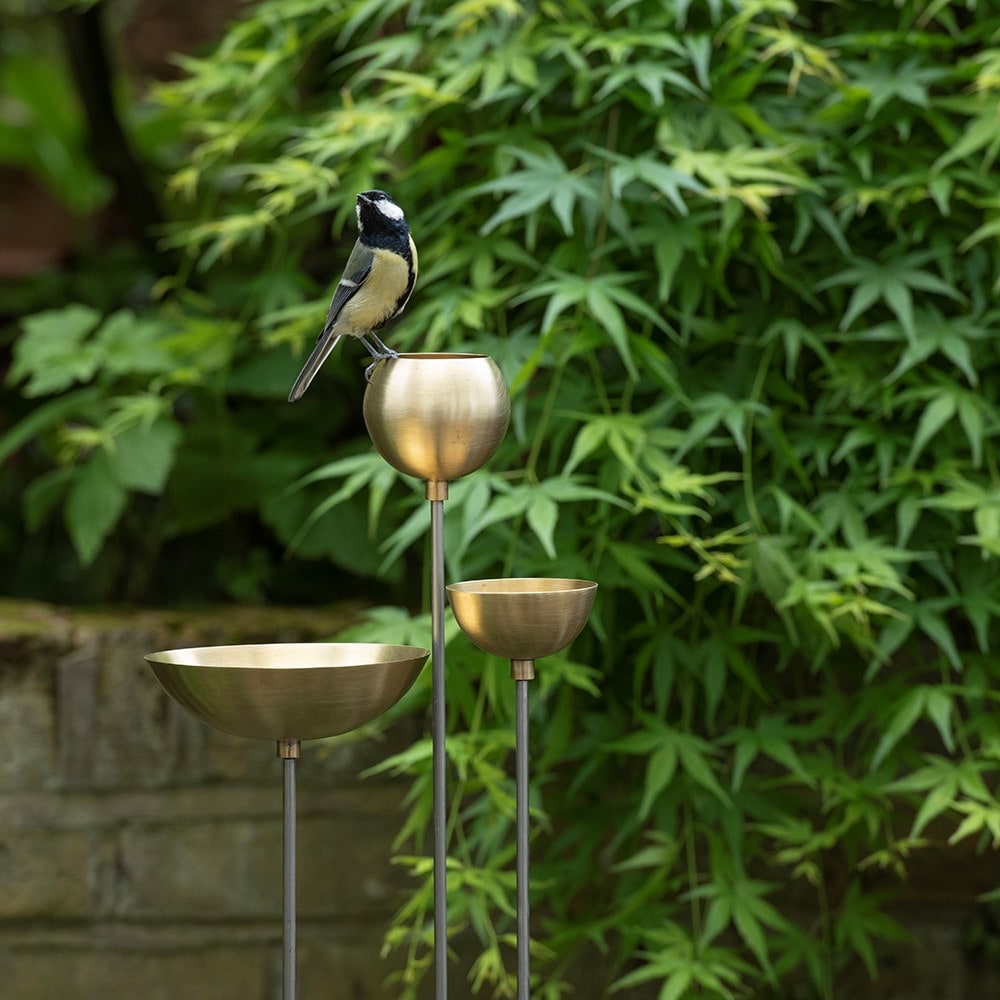 Brass bowl on stainless steel stake