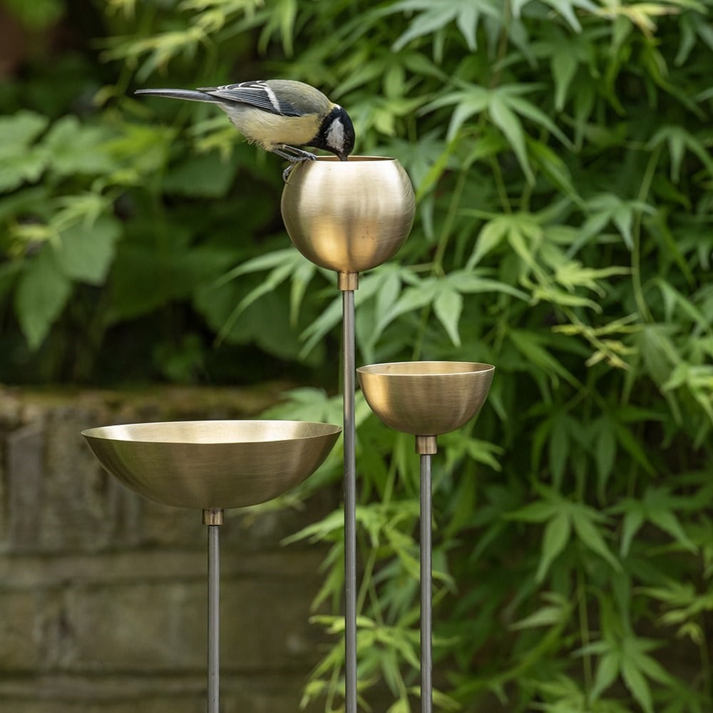 Brass bowl on stainless steel stake