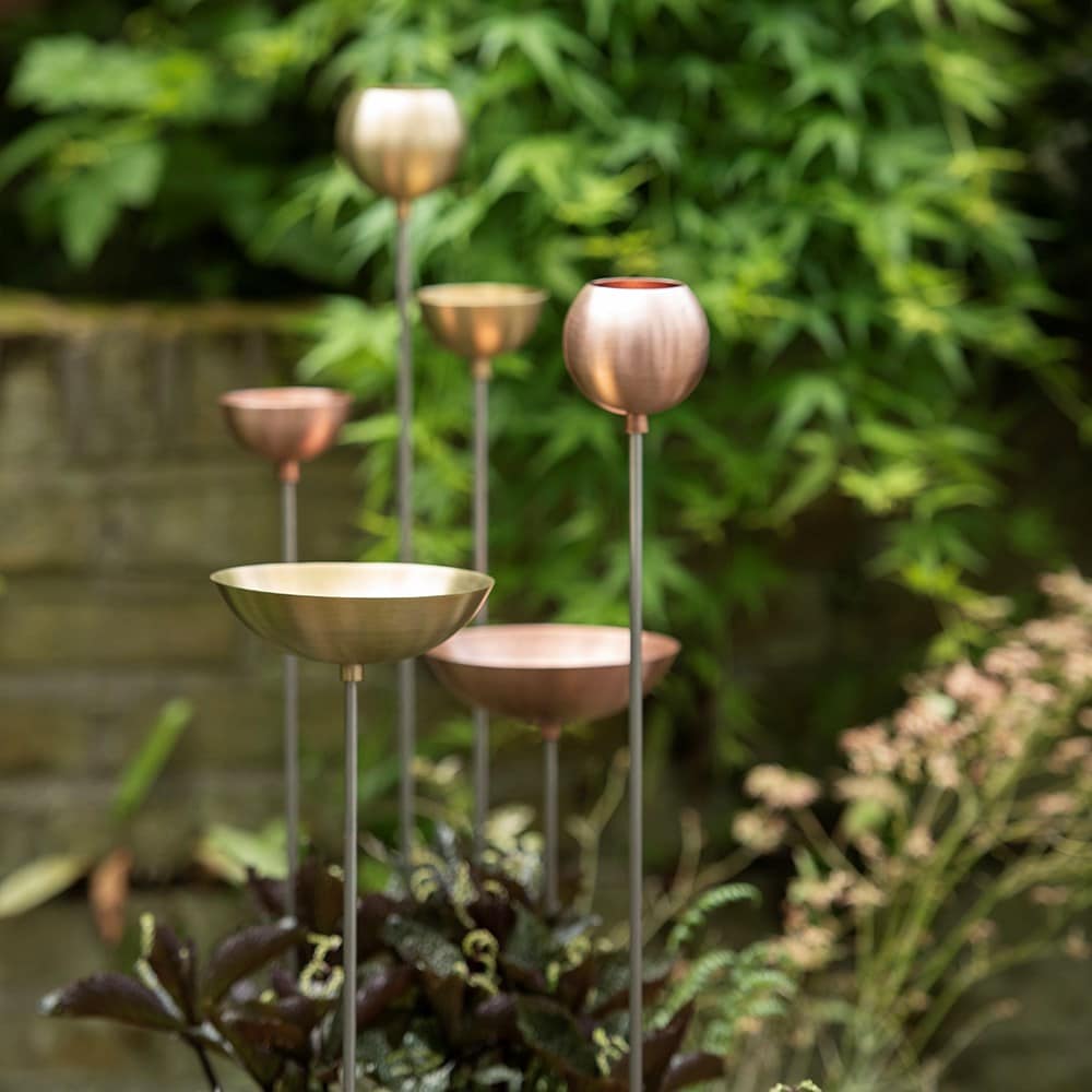 Brass bowl on stainless steel stake