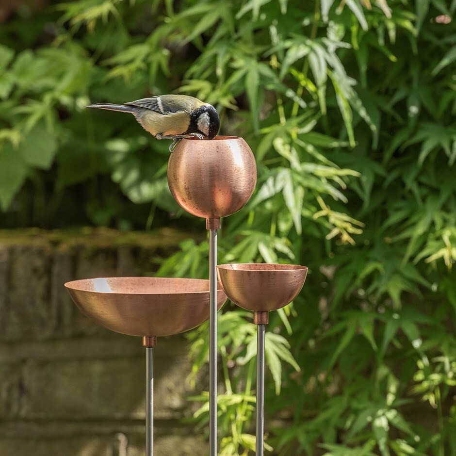 Copper bowl on stainless steel stake