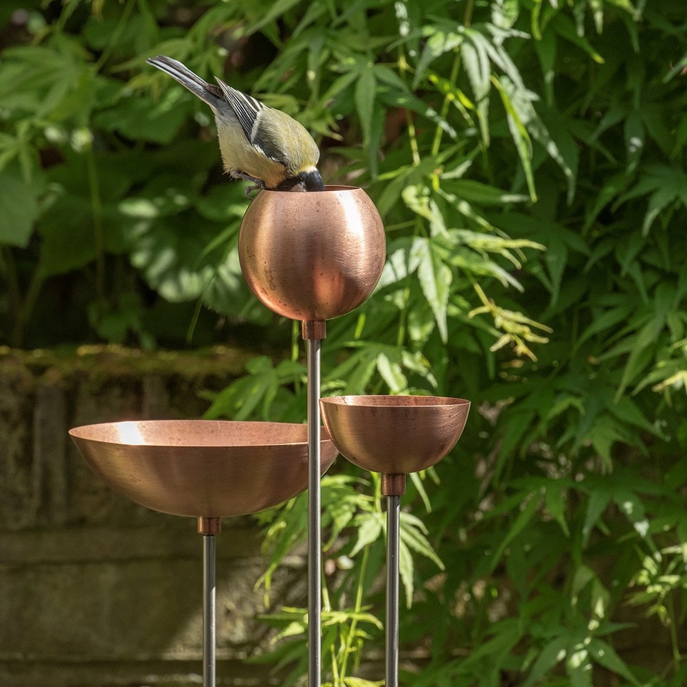 Copper bowl on stainless steel stake