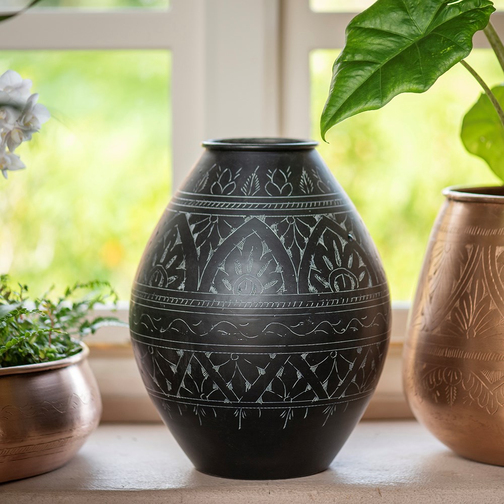 Traditionally etched black vase 
