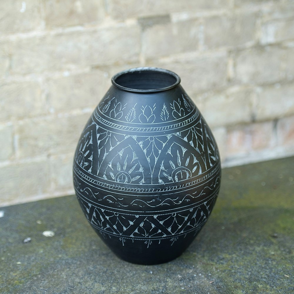 Traditionally etched black vase 