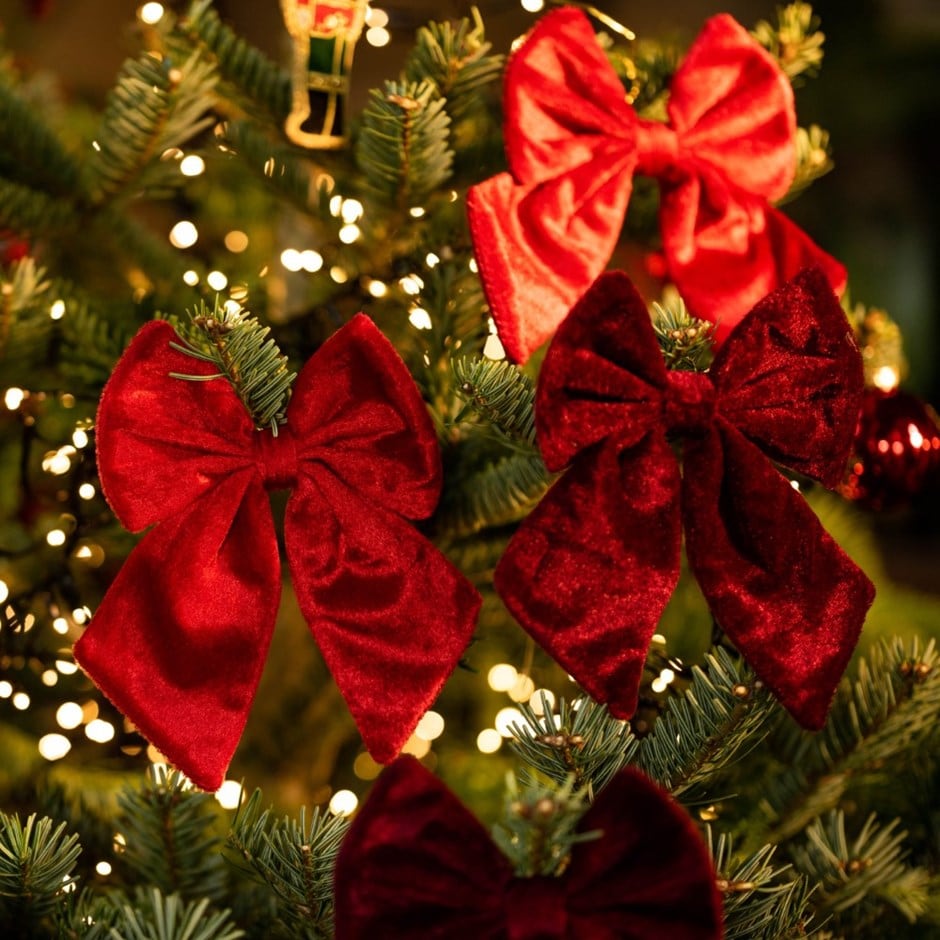 Four red and burgundy tree bows