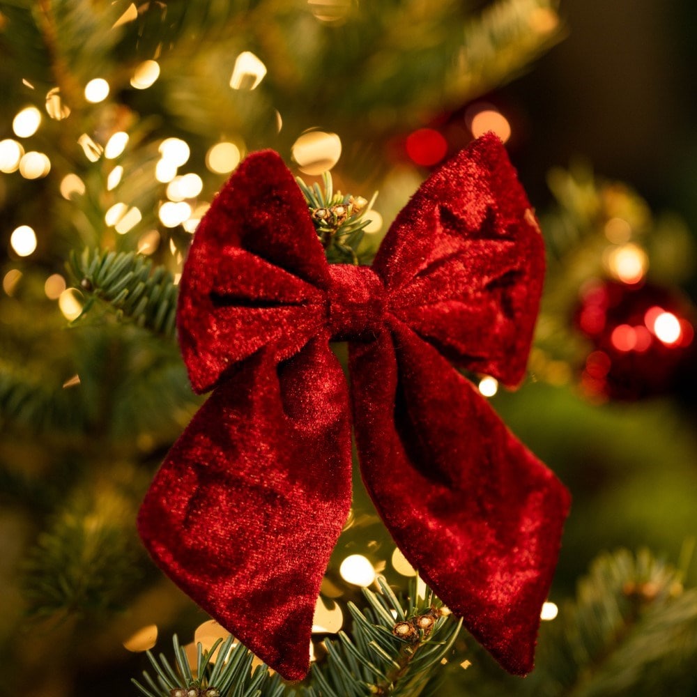 Four red and burgundy tree bows