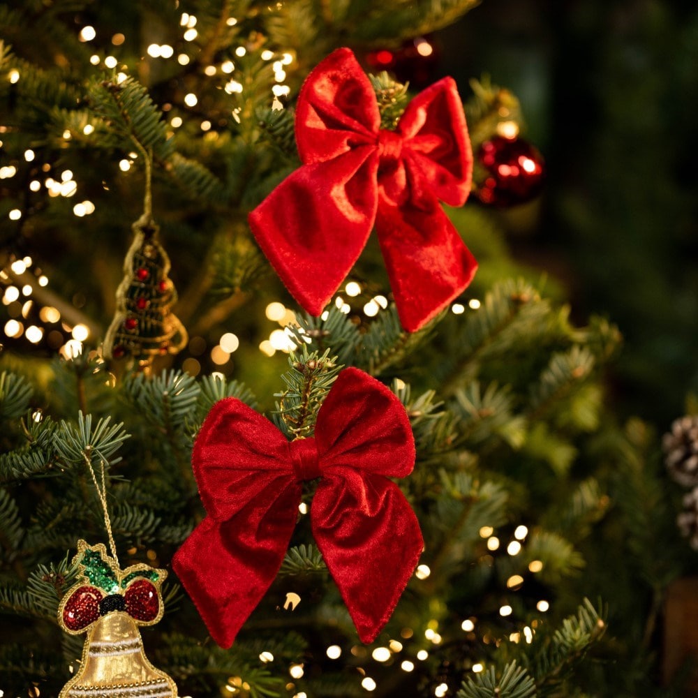 Four red and burgundy tree bows