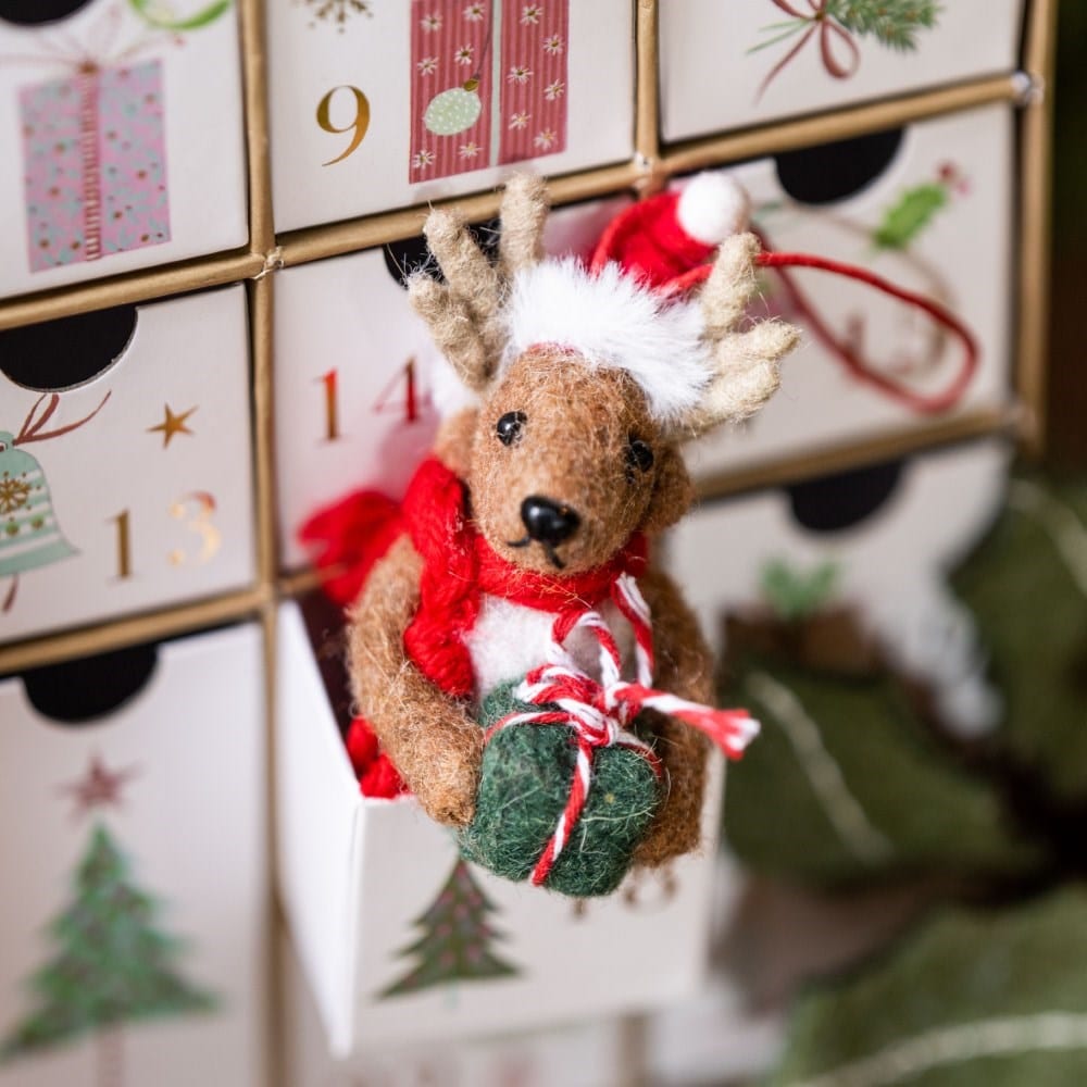 Felt reindeer with present