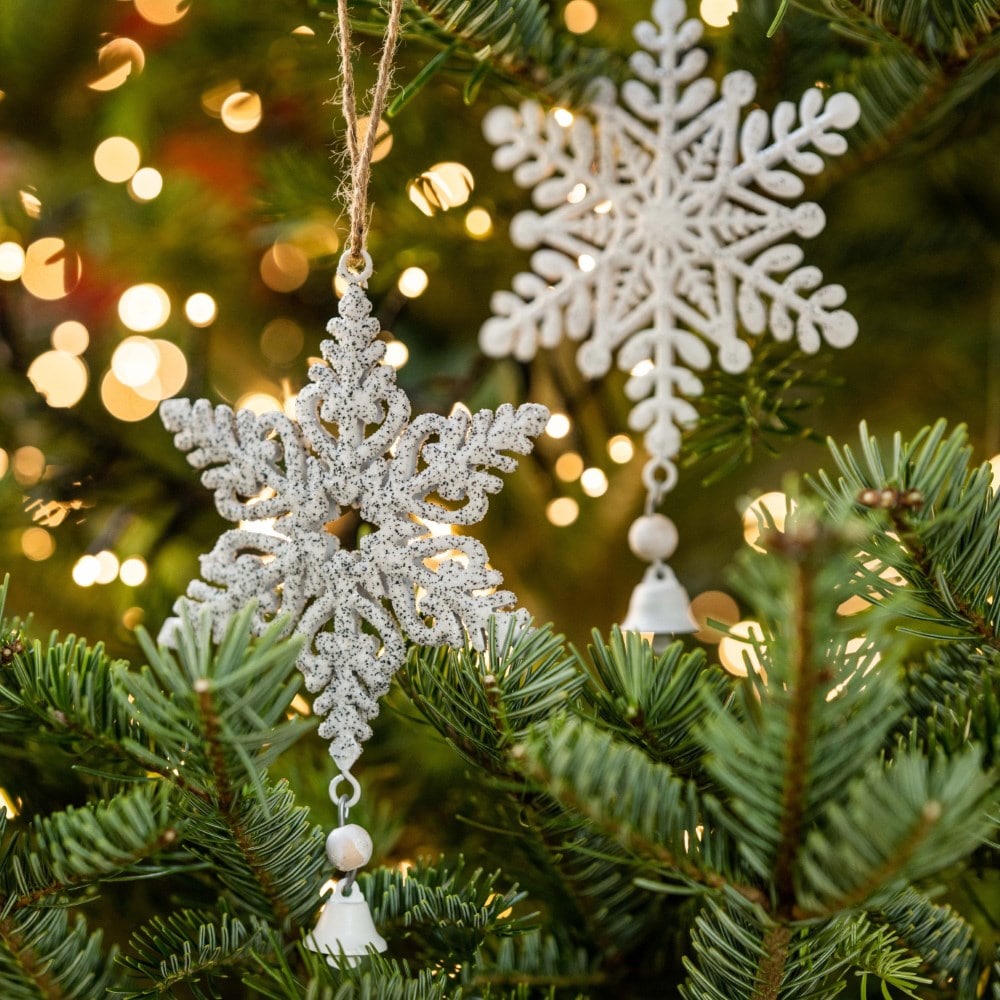 Two white metal snowflakes