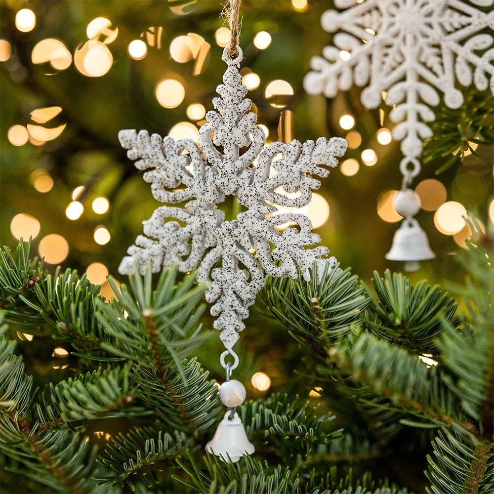 Two white metal snowflakes