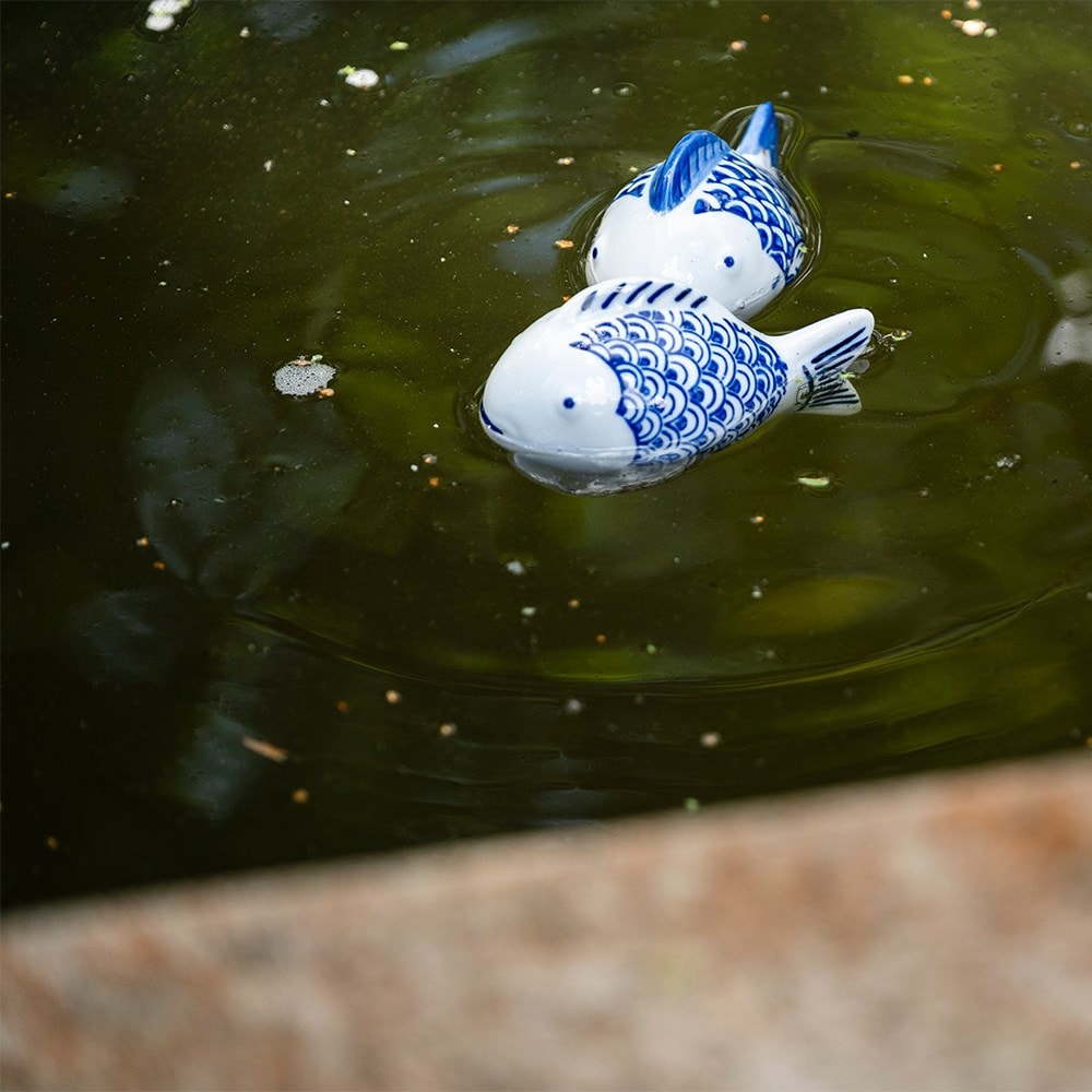 Pair of floating porcelain fish