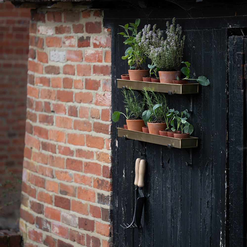 Brushed brass tray with wall brackets