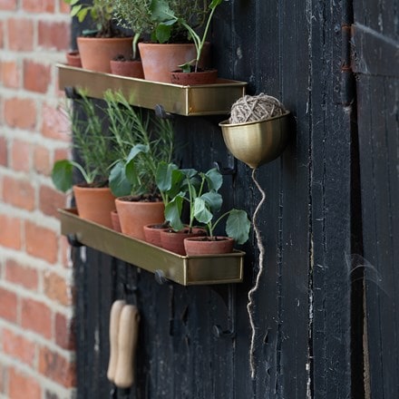 Brushed brass tray with wall brackets