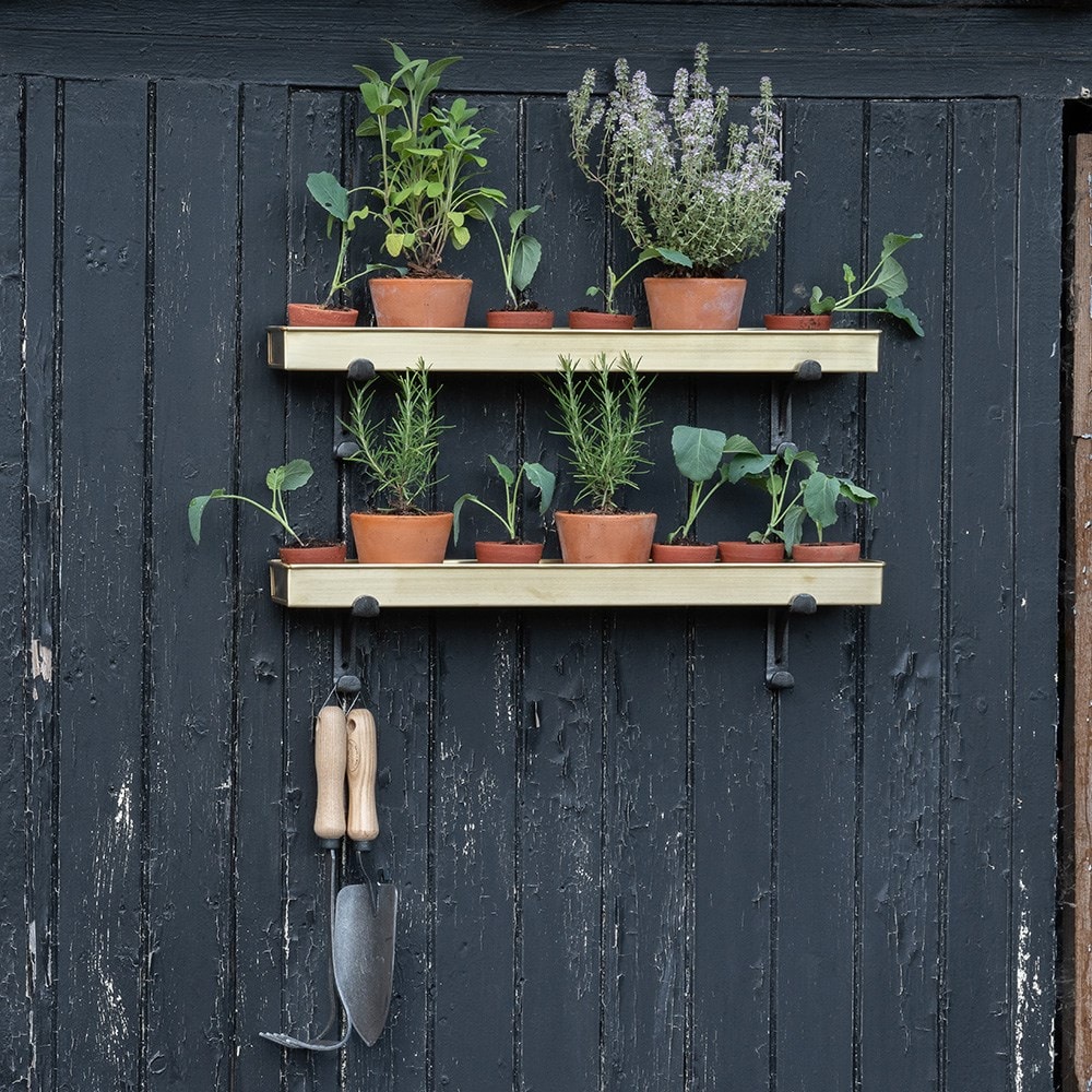 Brushed brass tray with wall brackets