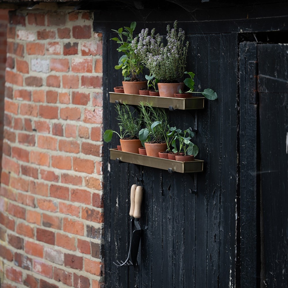 Brushed brass tray with wall brackets